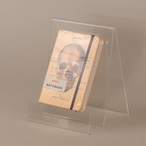 Notesbog med stregtegning af kranie
