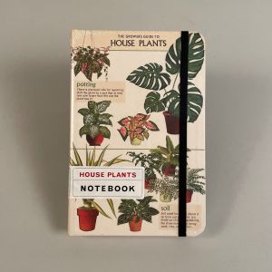 Notesbog med motiv af forskellige stueplanter.